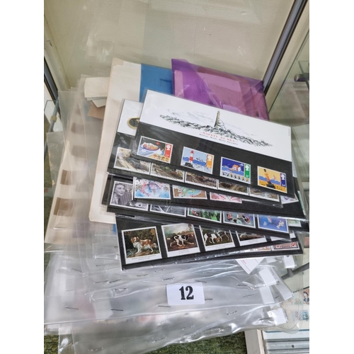 12 - Collection of assorted World Used Stamps and assorted Royal Mail Mint Stamp sets