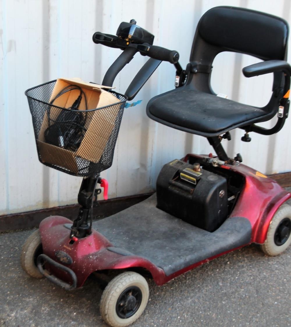 A Euro Electric Four Wheel Mobility Scooter In Red Trim With Front Basket 91cm H With Charger