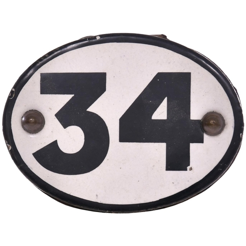 49 - A shedplate 34 as used by the LNWR at Patricroft from the 1870s to 1935. Mounted on a bracket at the... 