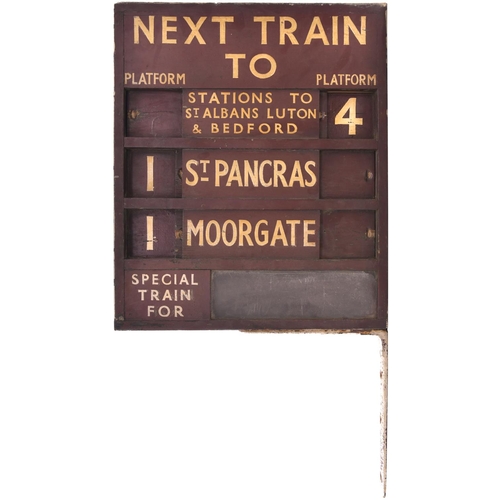 57 - A train departure and platform indicator NEXT TRAIN TO ST ALBANS, LUTON & BEDFORD PLATFORM 2/4, ST P... 