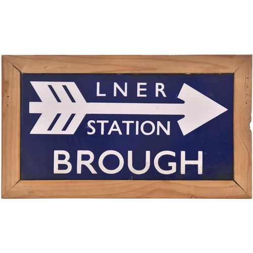 A London and North Eastern Railway station direction sign, LNER STATION BROUGH, (flangeless/double sided), from the Hull to Doncaster and Selby route. Enamel, 18½"x9½", within a wooden frame to display. Minor blemishes to the enamel, excellent colour and shine. (Postage Band: D)