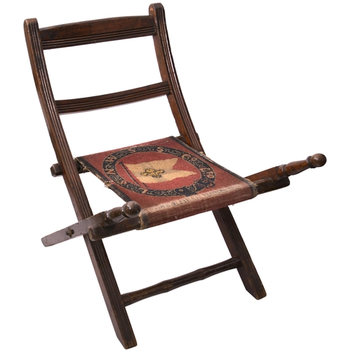 A deck chair, the cloth seat woven with coat of arms L&NWSS Co, wood in excellent condition, a little wear to the fabric, overall height 37". (Postage Band: N/A)