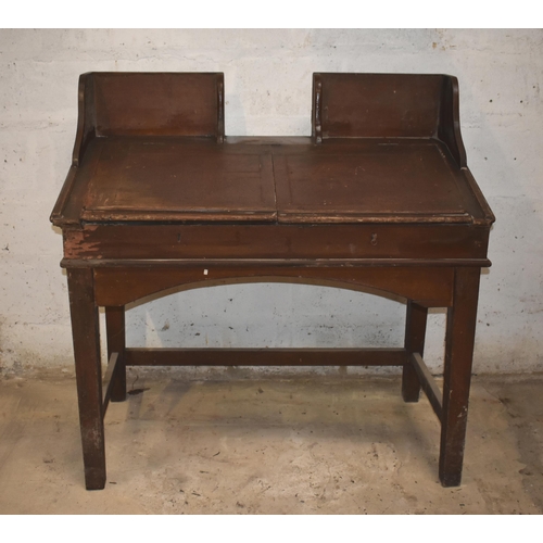 14 - A clerk's antique desk with woodgrain finish              
                                         ... 