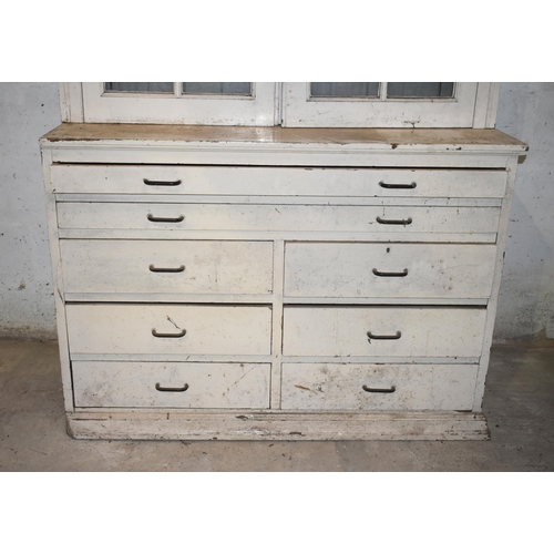 26 - A large pine glazed bookcase/plan chest                                                       

Subj... 