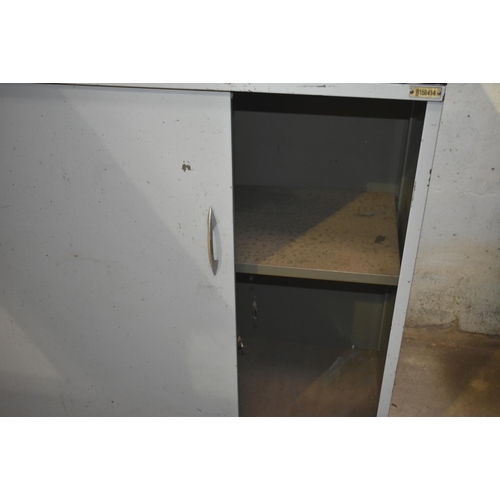 52 - A metal cupboard with sliding doors                             

Subject to VAT