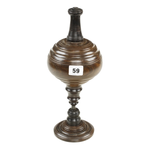 59 - A recent very decorative lignum and ebony plumb bob with steel point on matching stand 12
