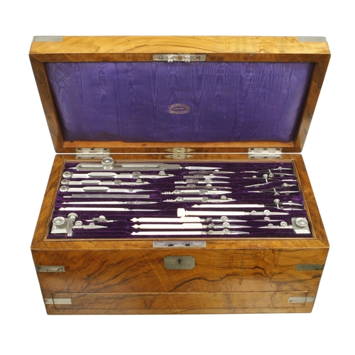 An exceptional, little used, drawing set by J.A.REYNOLDS Birmingham c/w fitted tray of 24 German silver instruments, the lower tray with set of boxwood offsets, an ebony and brass rolling rule, a 2' four fold architects ivory rule with inside and outside bevel edges and German silver protractor hinge, a 6" ivory sector with protractor hinge and a scale rule all by Reynolds t/w a draughtsman's protractor, the drawer under with set of little used paints mostly still in orig wrappers c/w an early Reynolds 32 page catalogue with prices all contained in the orig nickel silver trimmed rosewood box, all contents, except the four fold rule, are original to the box F
