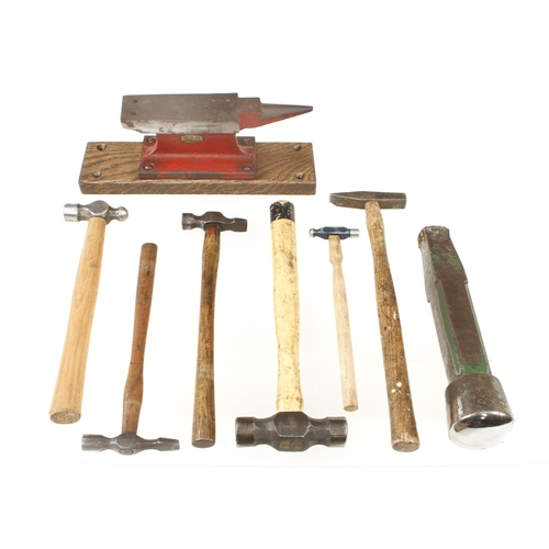 52 - Six panel beater's hammers, a small anvil and a stake G