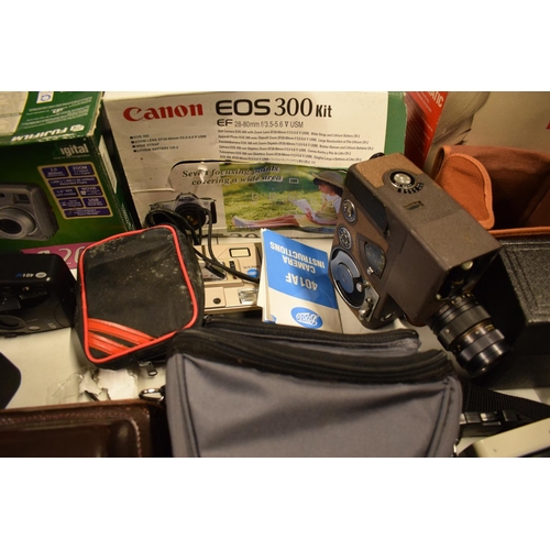 5K - A mixed collection of cameras and accessories to include Kodak, Canon, JVC etc

Condition is mixed. ... 