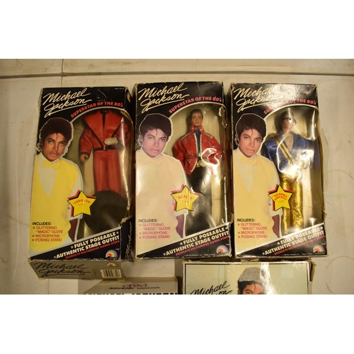 5W - A collection Michael Jackson figures and toys to include 'BAD' figure, electronic microphone and Sup... 