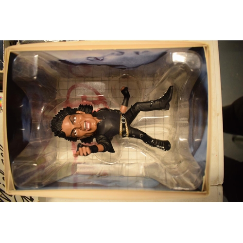 5W - A collection Michael Jackson figures and toys to include 'BAD' figure, electronic microphone and Sup... 