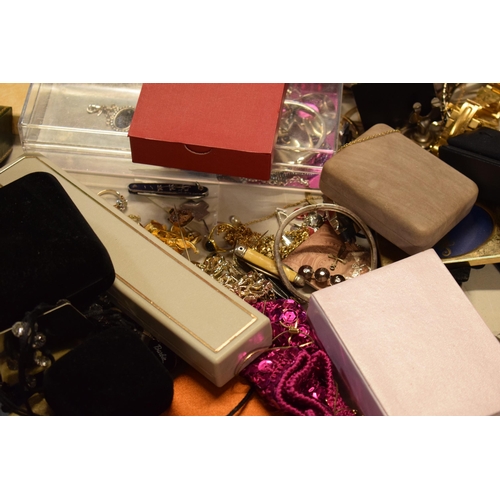 13 - A large collection of costume jewellery to include fashion watches, gold plated jewellery, chains, e... 