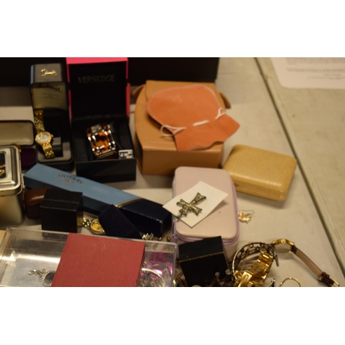 13 - A large collection of costume jewellery to include fashion watches, gold plated jewellery, chains, e... 
