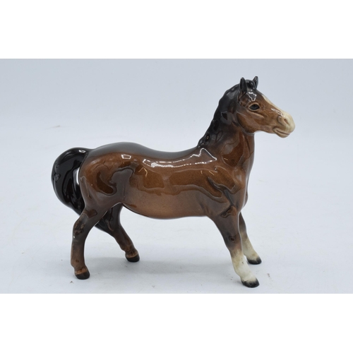 148 - Beswick brown girls pony 1483. In good condition with no obvious damage or restoration.