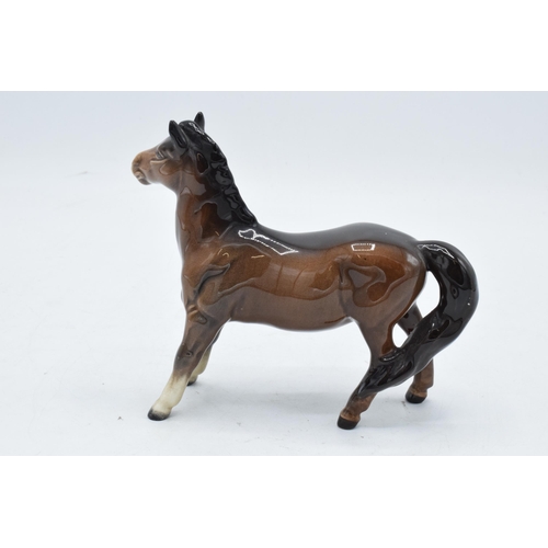 148 - Beswick brown girls pony 1483. In good condition with no obvious damage or restoration.