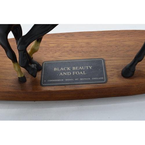 155A - Beswick Black Beauty and Foal on wooden base. In good condition no obvious damage or restoration.