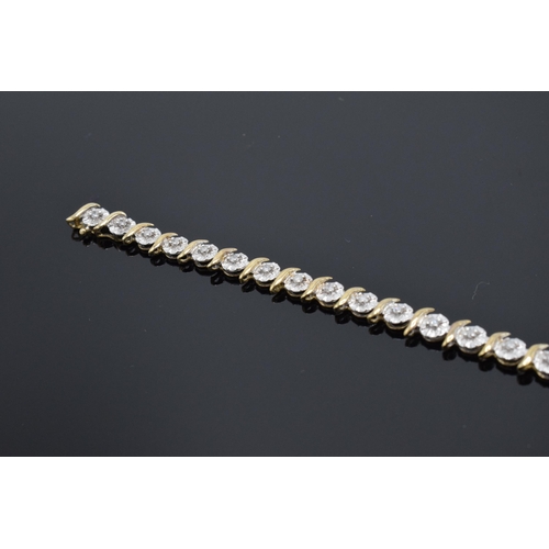 202 - 9ct gold and white gold tennis bracelet with illusion set diamonds. 6.3 grams. 19cm long.