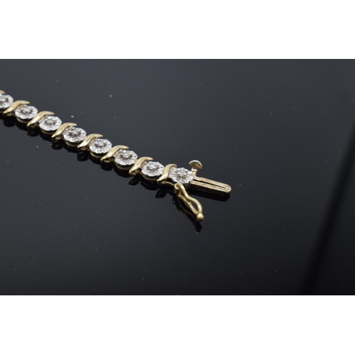 202 - 9ct gold and white gold tennis bracelet with illusion set diamonds. 6.3 grams. 19cm long.