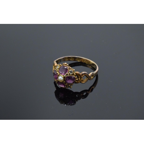 203F - Victorian 12ct gold ladies ring set with a seed pearl and amethyst stones. 1.7 grams. UK size O.