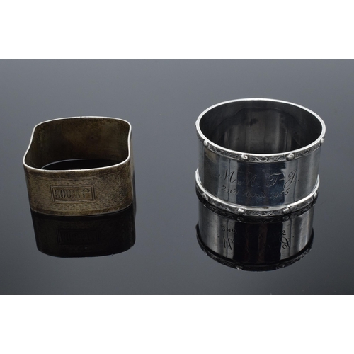 205 - A pair of silver napkin rings, one circular Birmingham 1954 and a square example Birmingham 1928. 42... 