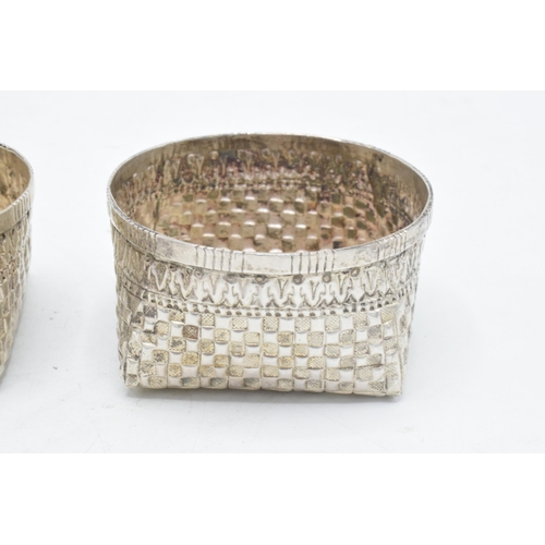 210 - A pair of foreign silver bon bon dishes with patchwork decoration. Tested as low grade silver. 105.4... 