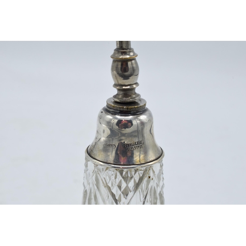 222 - A silver topped scent bottle with a stopper (Birmingham 1910) together with a sterling silver topped... 