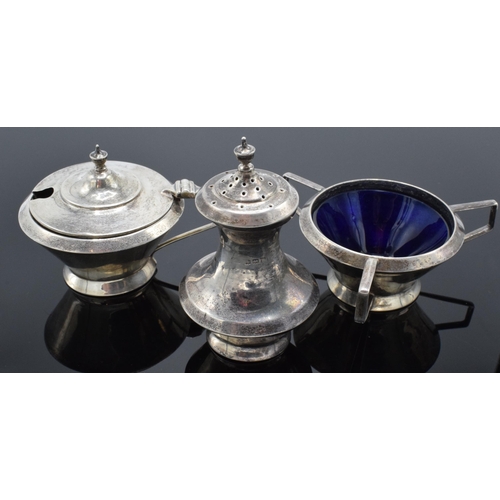230 - A matched cruet set to include a pepper pot and 2 condiment pots (3). 74.7 grams of silver.