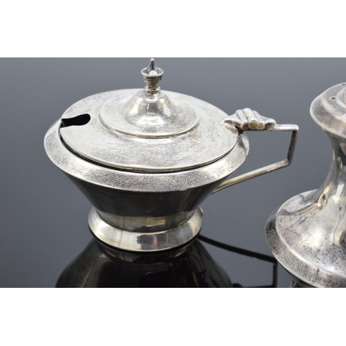 230 - A matched cruet set to include a pepper pot and 2 condiment pots (3). 74.7 grams of silver.