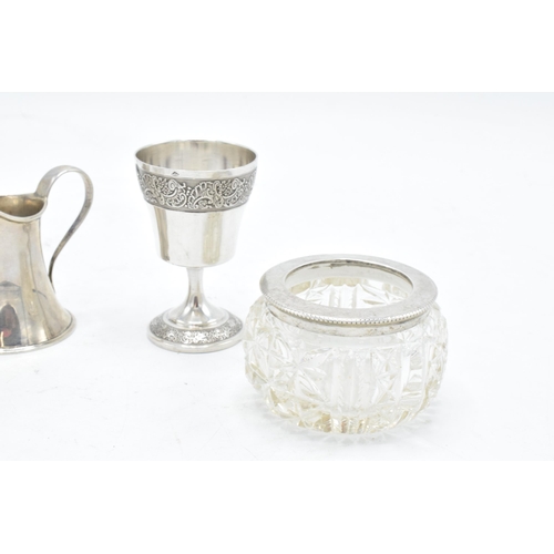 231 - A collection of silver items to include a pair of silver topped salts (London 1900), a miniature cre... 