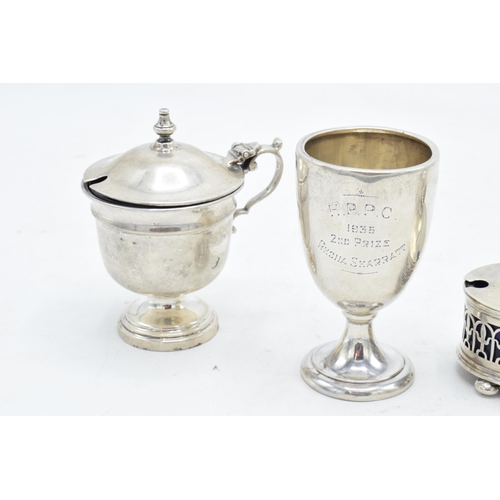 232 - A collection of silver to include matched cruets and a small beaker (4). 181.9 grams of silver.