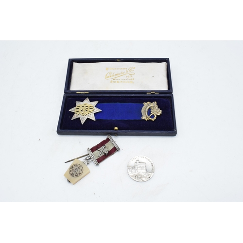 238 - A cased silver attendance medal together with a George V commemorative coin and a Masonic type jewel... 
