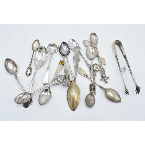 242 - A collection of continental silver and similar items to include spoons, sugar tongs, tea spoons etc.... 