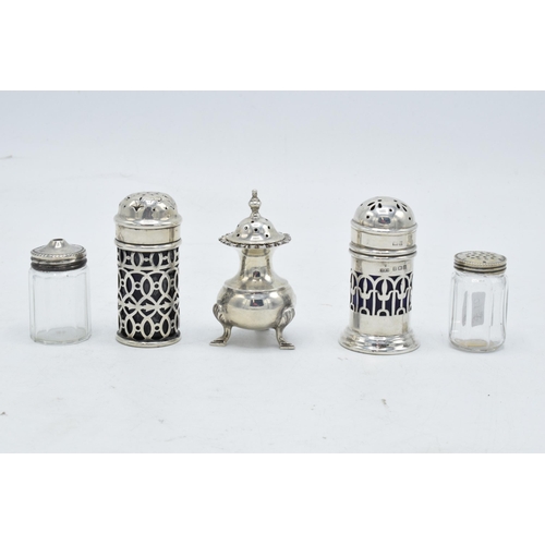243 - A collection of silver cruets and a near pair of sterling silver topped glass cruets (5).