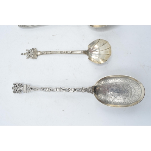 245 - A collection of spoons to include a Paul Orr Madras Indian silver serving spoon, Selangor preserve s... 