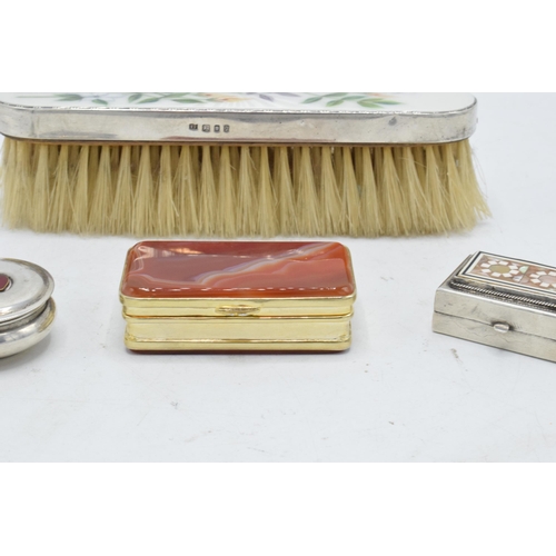 246 - A collection of silver items to include a Guilloche enamel hand brush with silver mount, a gilt meta... 