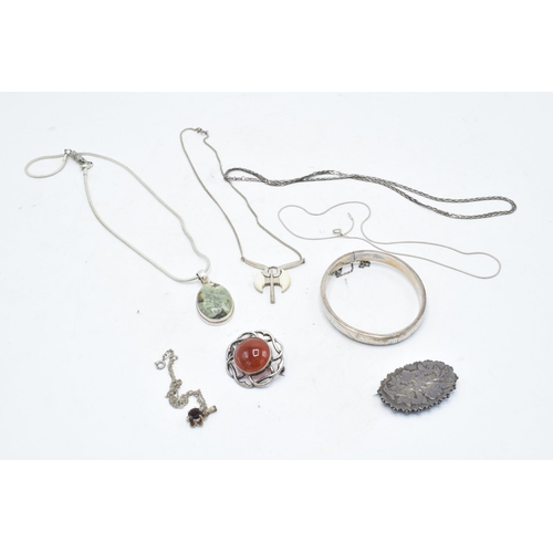 248 - A collection of silver jewellery to include brooches, chains, pendants etc. Gross weight 73.7 grams.
