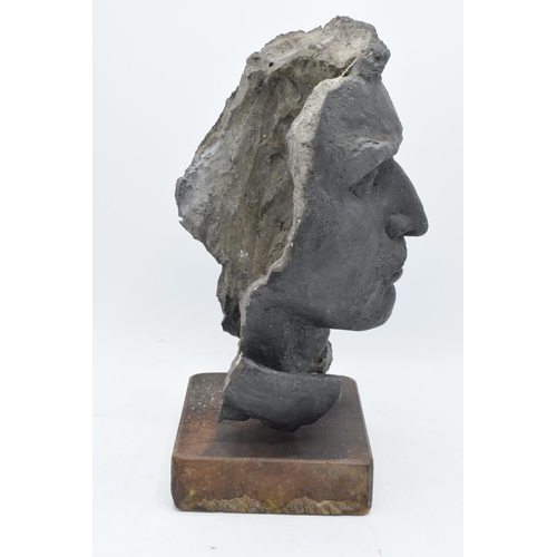 253 - A 20th century studio-made bust of a gentleman mounted on a wooden base. 34m tall.