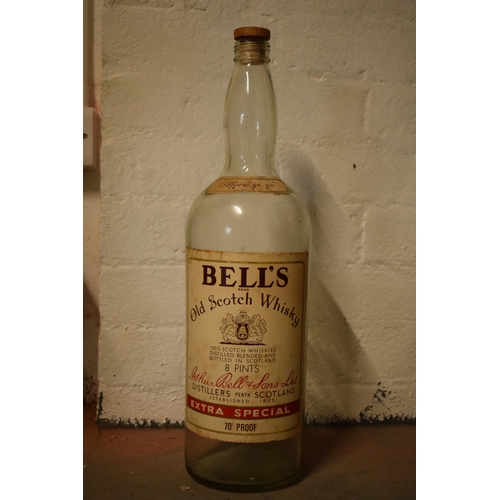 254 - A large vintage Bells Old Scotch Whiskey bottle. 51cm tall.