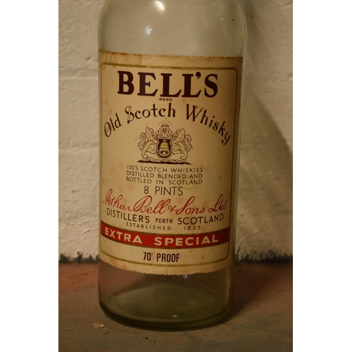 254 - A large vintage Bells Old Scotch Whiskey bottle. 51cm tall.