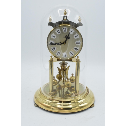 256 - A 20th century anniversary clock with dome made by Kieninger & Obergfell with key. Appears to be in ... 