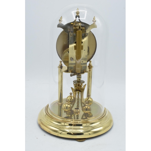 256 - A 20th century anniversary clock with dome made by Kieninger & Obergfell with key. Appears to be in ... 