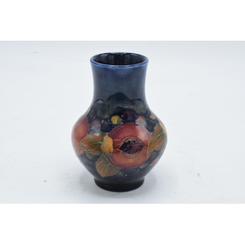 60 - Moorcroft low-shouldered vase in the Pomegranate design. In good condition with no obvious damage or... 