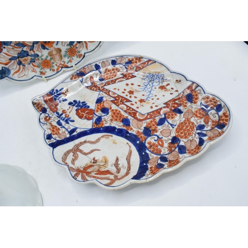 61 - A collection of oriental pottery to include 19th century Japanese items such as a shell shaped Imari... 