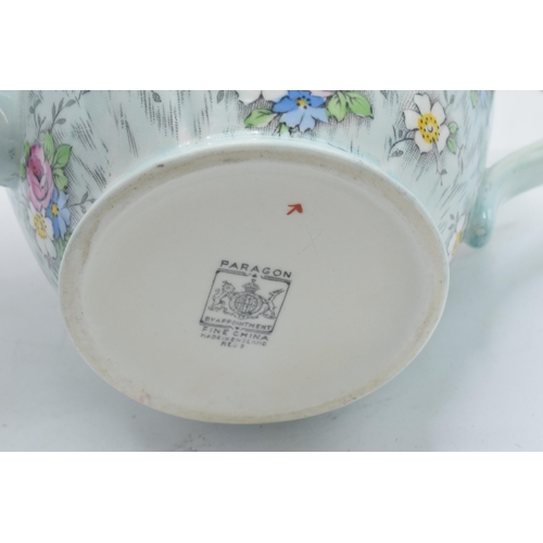 69 - Paragon Fine China teapot with floral decoration on a light blue / duck egg green background. In goo... 