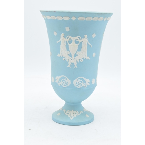 79 - An unusual Wedgwood Jasperware vase in a light blue / aqua blue colour with traditional scenes. 19cm... 