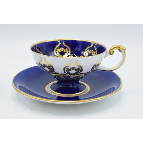 84 - A collection of Aynsley cups and saucers to include a pink rose / cabbage rose example, a similar bl... 