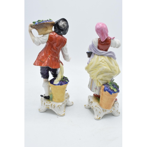 99 - A pair of Rudolf Kammer continental porcelain figures of grape pickers (2).  In good condition with ... 