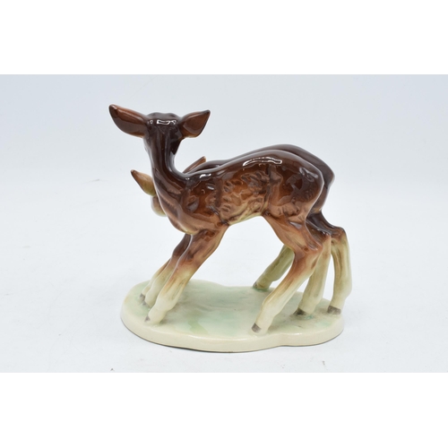 148B - A 20th century German porcelain figure of a pair of deer. 2215. Good detailing and quality. In good ... 
