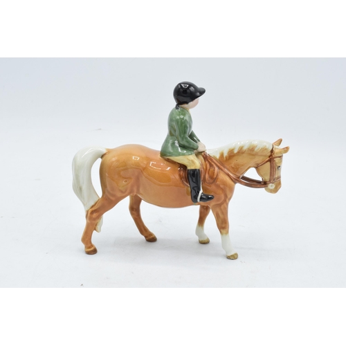 148L - Beswick boy on pony 1500. In good condition with no obvious damage or restoration though head has be... 