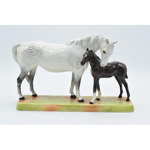 148N - Beswick Mare and Foal - grey mare with dark brown foal on ceramic grass base 1811. In good condition... 